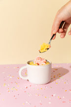 vanilla sprinkles cake in a mug flour and dough