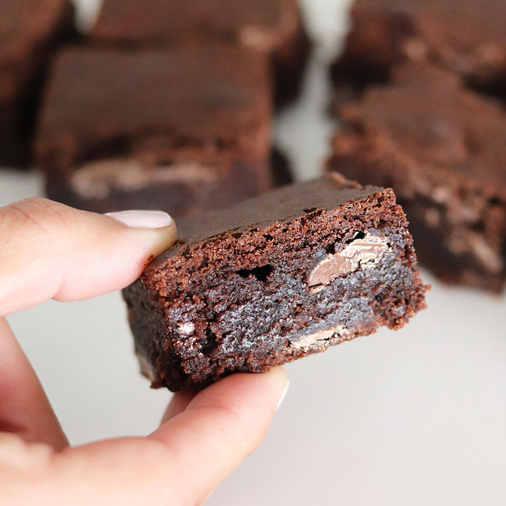 close up flour and dough brownie sqaure