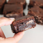 close up flour and dough brownie sqaure